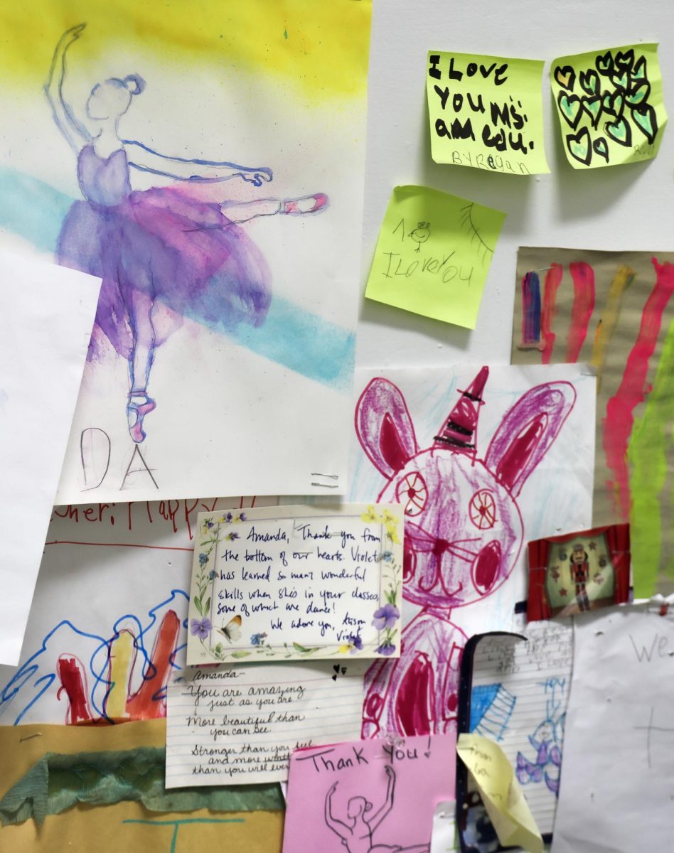 On the wall behind Kentucky Dance Academy founder and dance instructor Amanda Whites’ desk are drawings and notes from her students that she has collected over the years.