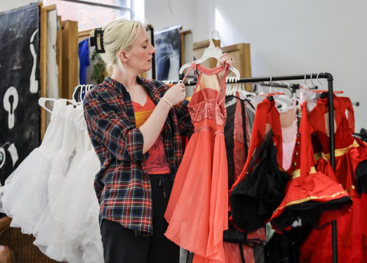 Amanda Whites, founder and dance instructor at Kentucky Dance Academy, organizes outfits for their upcoming Nutcracker showcase before practice on Wednesday, Oct. 11, 2023, in Frankfort, Kentucky.