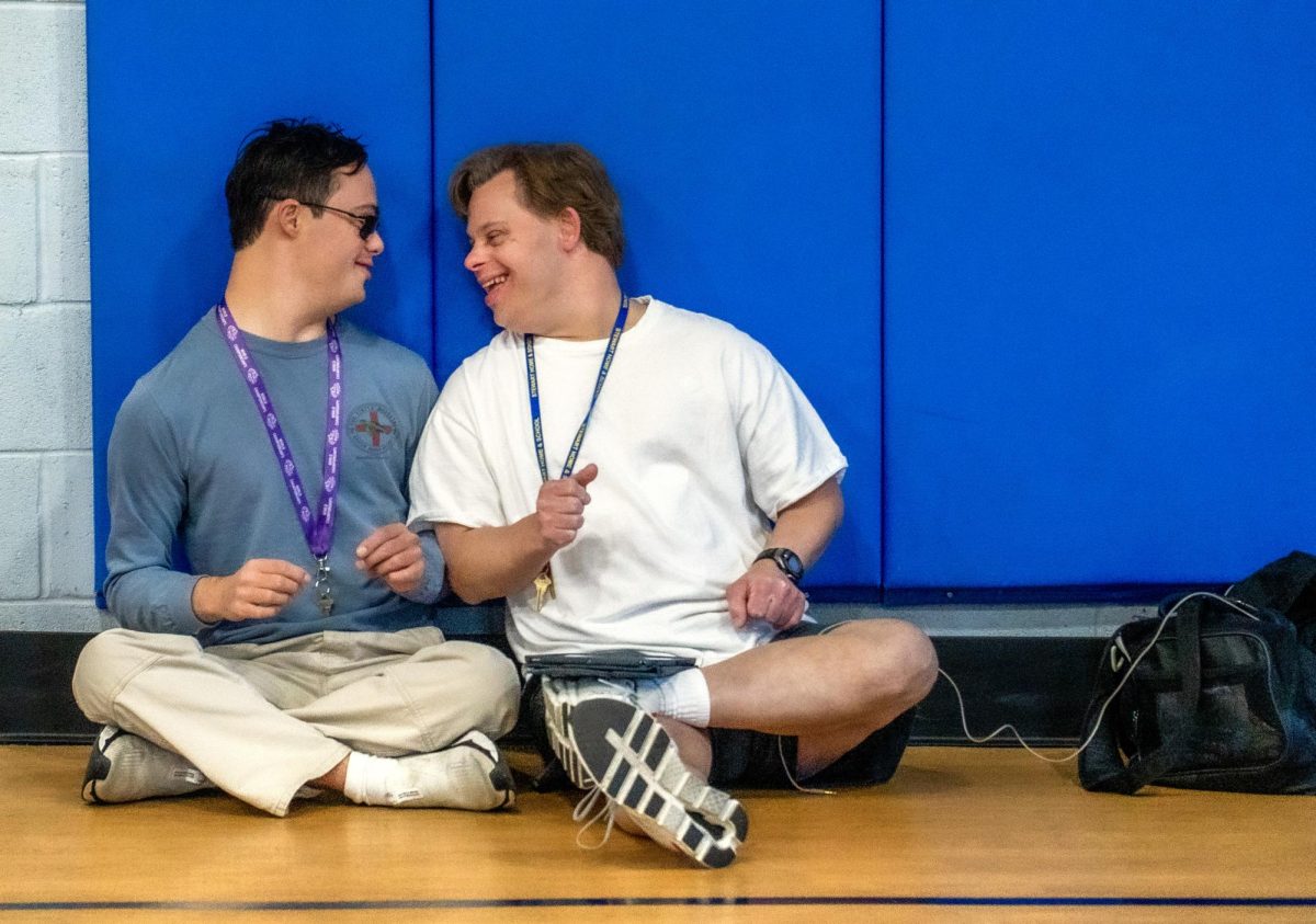 Luke Sorrentino and Justin Flenniken, students, laughing at eachother during extra-cirrcular time on Thursday, Oct 12, 2023, in the gym on Stewart Home School’s campus. Photo by Carlee Hogsten.