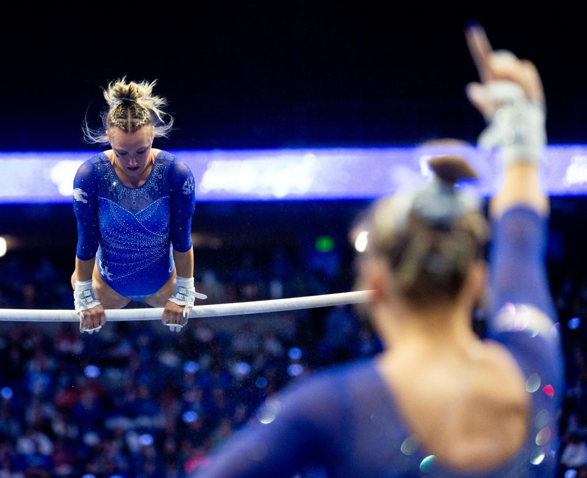 Raena Worley prepares for her bars routine during the No. 7 Kentucky vs. No. 18 Georgia gymnastics meet on Friday, January 26, 2024, at Rupp Arena in Lexington, Kentucky. Kentucky won 197.950-195.650. Photo by Brady Saylor | Staff
