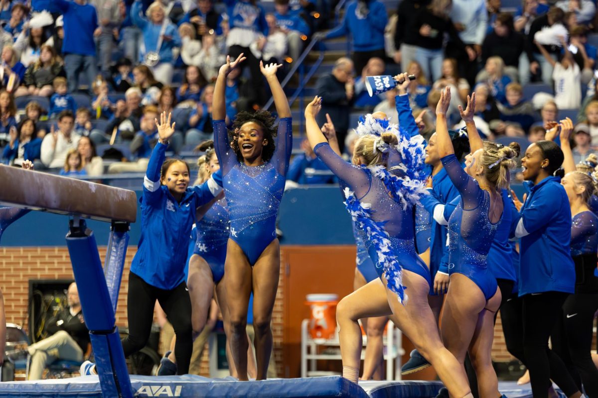 Kentucky celebrates after redshirt fifth year Arianna Patterson completes her beam routine during the No. 7 Kentucky vs. No. 18 Georgia gymnastics meet on Friday, January 26, 2024, at Rupp Arena in Lexington, Kentucky. Kentucky won 197.950-195.650. Photo by Ella Porter | Staff