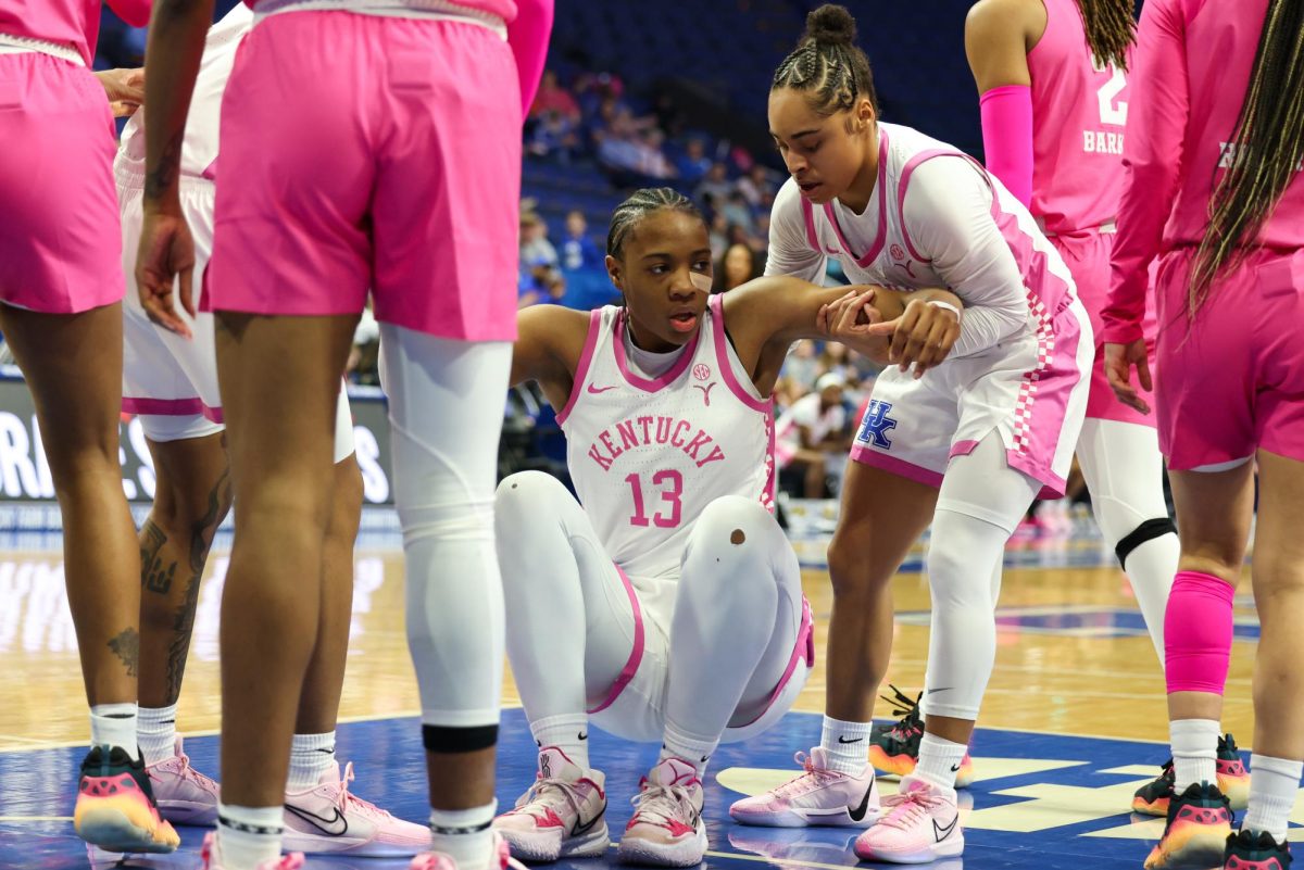 Kentucky forward Ajae Petty gets helped up by Kentucky guard Brooklynn Miles during Kentucky vs Texas A&M women’s basketball game on Sunday, February. 11, 2024, at Rupp Arena in Lexington, Kentucky. Kentucky lost 44-61. Photo by Sydney Yonker | Staff