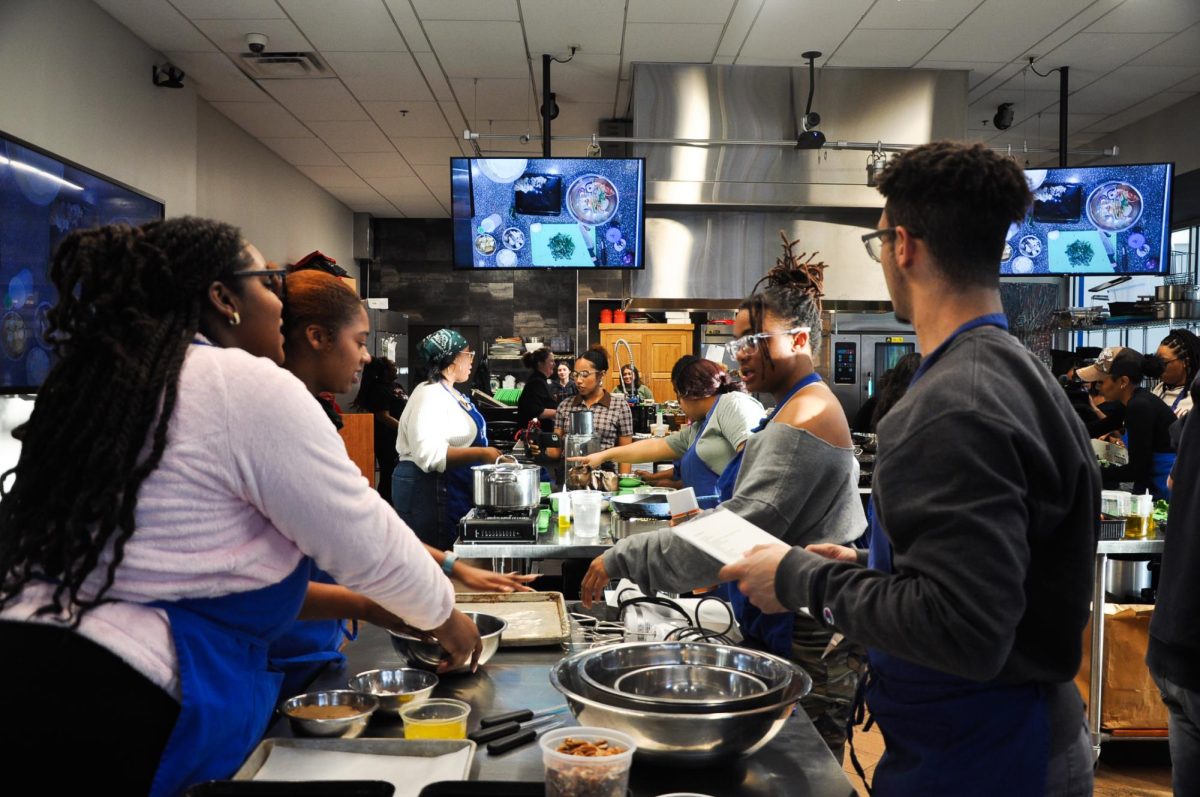 Students prepare ingredients for sweet potato casserole at a Cooking Up Community event on Monday, Feb. 19, 2024, at The 90 at the University of Kentucky in Lexington, Kentucky. Photo by Isabella Sepahban | Staff