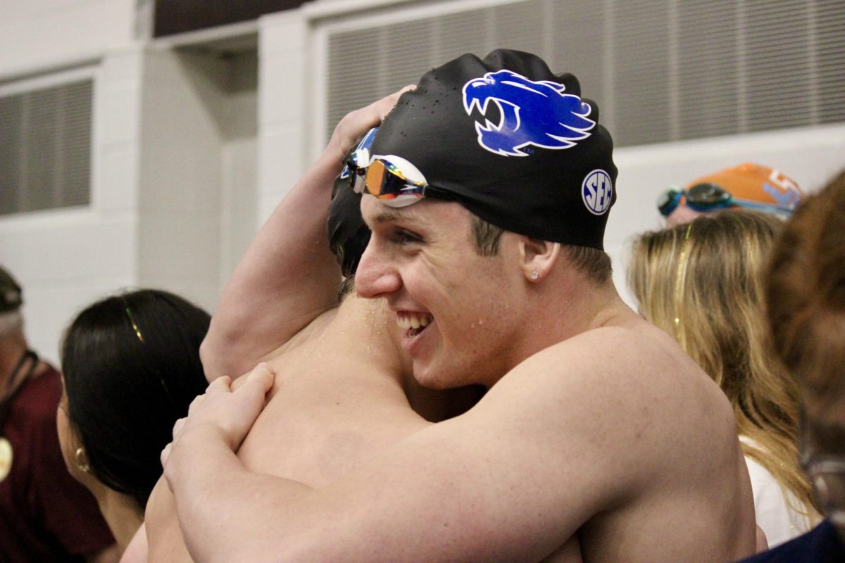 Kentucky swimmers hug after competing during the 2024 SEC Mens and Womens Swimming & Diving Championships on Saturday, Feb. 24, 2024, at the James E. Martin Aquatic Center in Auburn, Alabama. Photo by Jenna Lifshen | Staff