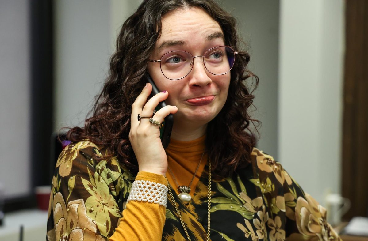 Cynthiana Democrat Regional Editor Kendall Staton talks to a local business owner on the phone on Tuesday, Jan. 23, 2024, at the Democrat office in Cynthiana, Kentucky. Photo by Abbey Cutrer | Staff