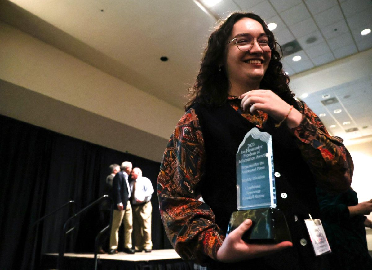 Cynthiana Democrat Regional Editor Kendall Staton accepts her Jon Fleischaker Freedom of Information Award during the Kentucky Press Association Awards on Friday, Jan. 26, 2024, at the Holiday Inn University Plaza in Bowling Green, Kentucky. The Fleischaker Award is given to journalists who demonstrate exceptional use of public records for reporting. Staton won this award less than a year after graduating college. Photo by Abbey Cutrer | Staff