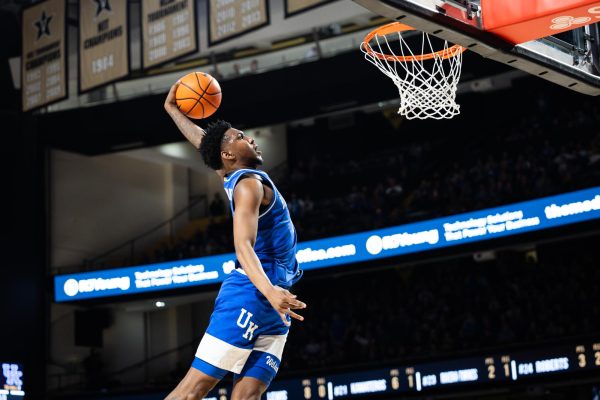 Kentucky guard Justin Edwards (1) goes for a windmill dunk during the Kentucky vs Vanderbilt mens basketball game on Tuesday, Feb. 6, 2024, at Memorial Gymnasium in Nashville, Tennessee. Kentucky won 109-77. Photo by Samuel Colmar | Staff