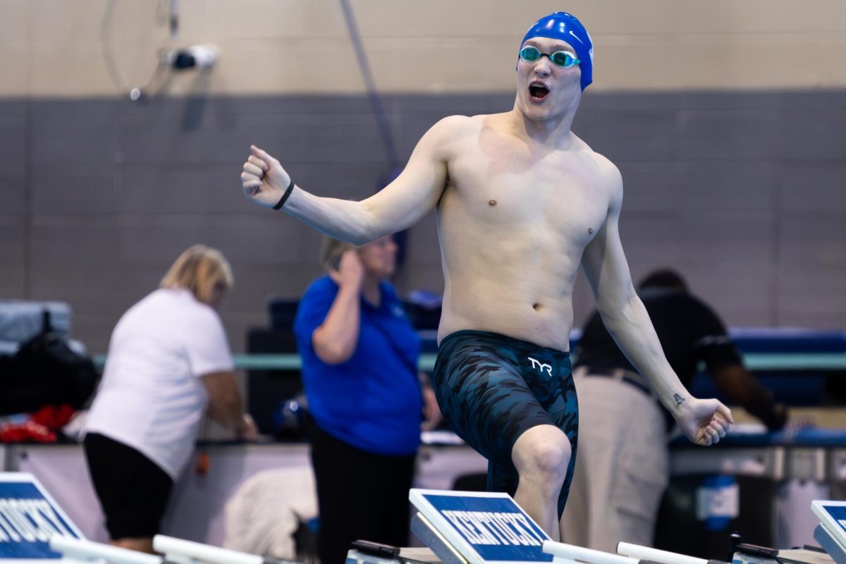 A Kentucky mens swimmer celebrates during the Kentucky Swim & Dive Senior Night and meet against the University of Cincinnati on Friday, Feb. 2, 2024, at the Lancaster Aquatic Center in Lexington, Kentucky. Kentucky Mens swim & dive won 186-111, while Kentucky Womens swim & dive won 207-93. Photo by Samuel Colmar | Staff
