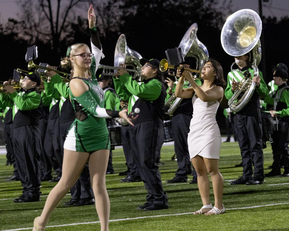 Samantha Ramsey, a majorette pictured on the left, plays next to Denise Waddell. Photo by Bryce Towle.