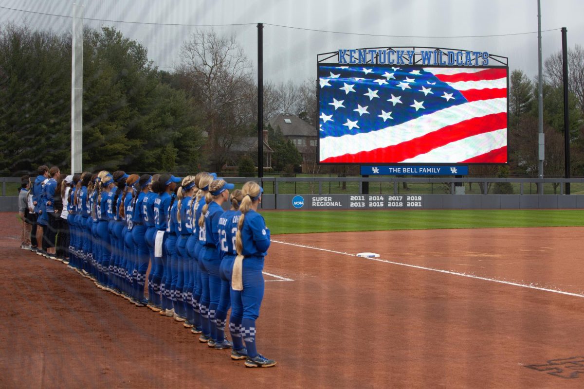 Kentucky players stand for the Star-Spangled Banner before the No. 21 Kentucky vs. Bellarmine softball match on Wednesday, March 6, 2024 at John Cropp Stadium in Lexington, Kentucky. Kentucky won 3-1. Photo by Christian Kantosky | Staff