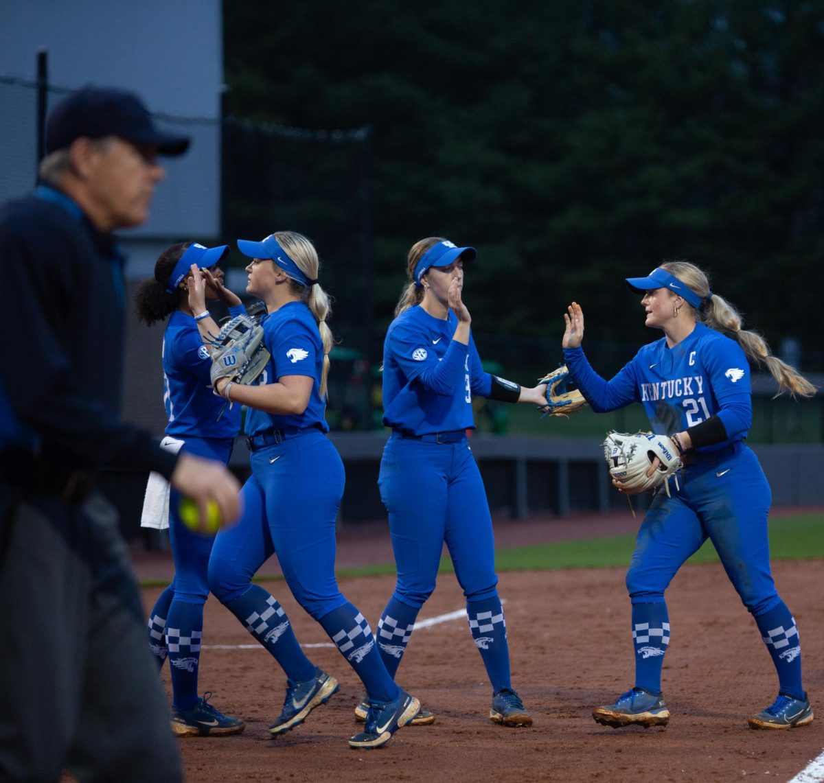 Kentucky players enter the dugout after securing three outs during the No. 21 Kentucky vs. Bellarmine softball match  on Wednesday, March 6, 2024 at John Cropp Stadium  in Lexington, Kentucky. Kentucky won 3-1. Photo by Christian Kantosky | Staff
