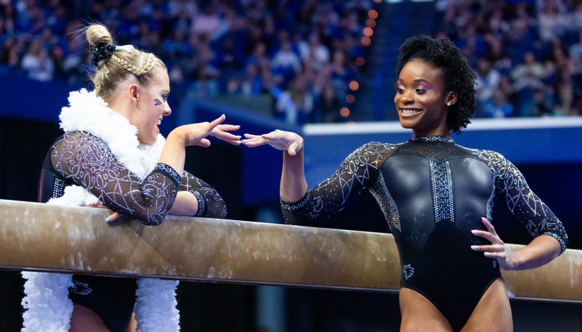 Bailey Bunn and Arianna Patterson talk to each other during the No. 6 Kentucky vs No 5. Florida gymnastics meet on Sunday, March 3, 2024 at Rupp Arena in Lexington, Kentucky. Kentucky lost 198.100-198.225.