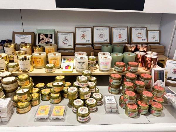 Specialty candles are displayed at the Poppy & Pomelo store during the “Braless & Lawless” event on March 8, 2024, in Lexington, Kentucky. Photo by Delaney Wells | Staff