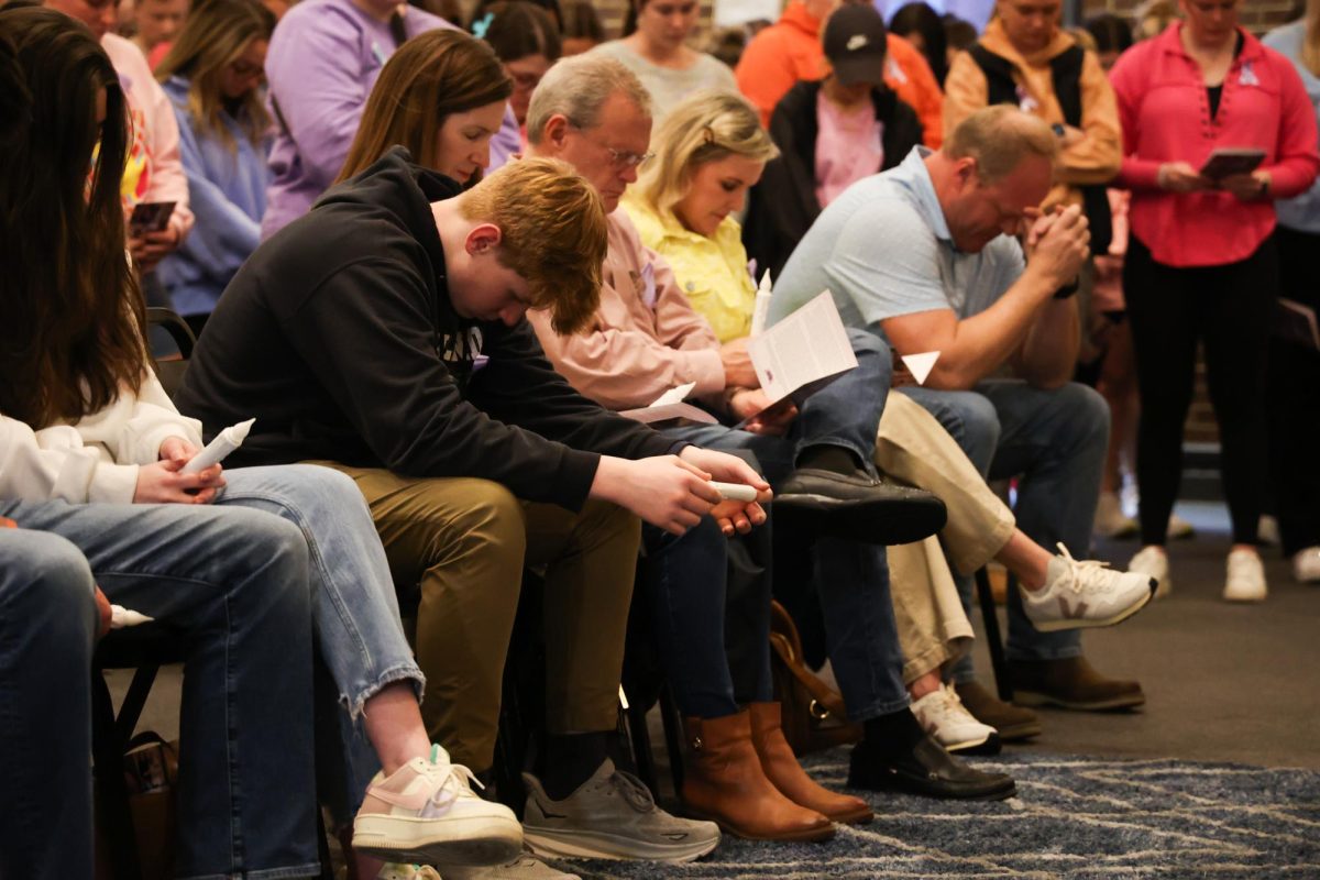 Parker Becknell bows his head in prayer mourning the death of his sister, Madison Becknell, during a vigil on Wednesday, March 6, 2024, at Baptist Campus Ministry in Lexington, Kentucky. Photo by Abbey Cutrer | Staff
