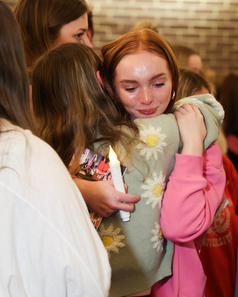 People hug during a vigil for Madison Becknell on Wednesday, March 6, 2024, at Baptist Campus Ministry in Lexington, Kentucky. Photo by Abbey Cutrer | Staff