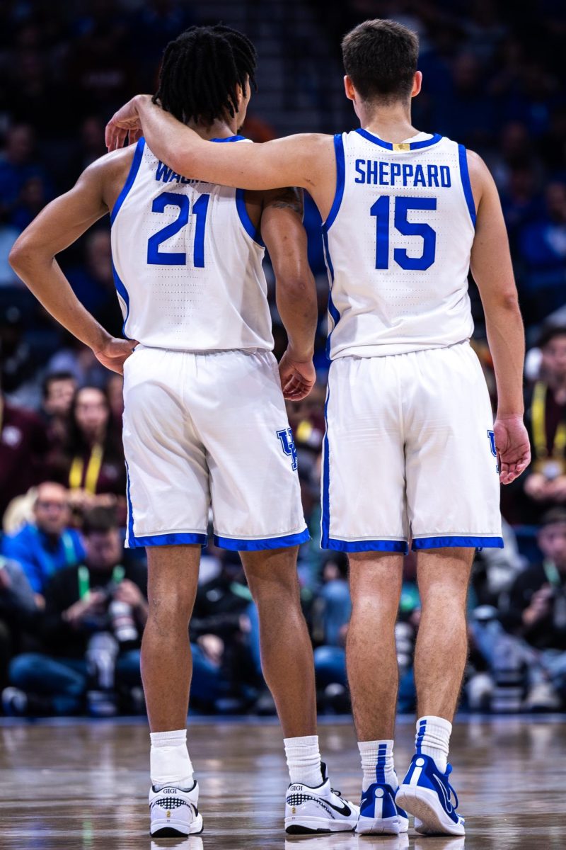 Kentucky guard DJ Wagner (21), left, stands with guard Reed Sheppard (15) during the No. 2 Kentucky vs. No. 7 Texas A&M mens basketball match in the SEC Tournament quarterfinals on Friday, March 15, 2024, at Bridgestone Arena in Nashville, Tennessee. Kentucky lost 97-87. Photo by Samuel Colmar | Staff