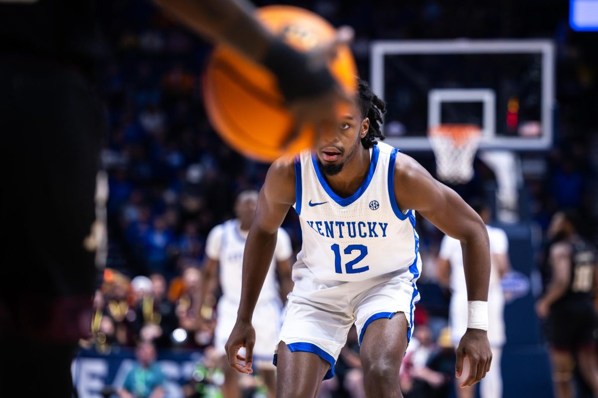 Kentucky guard Antonio Reeves (12) defends during the No. 2 Kentucky vs. No. 7 Texas A&M mens basketball match in the SEC Tournament quarterfinals on Friday, March 15, 2024, at Bridgestone Arena in Nashville, Tennessee. Kentucky lost 97-87. Photo by Samuel Colmar | Staff