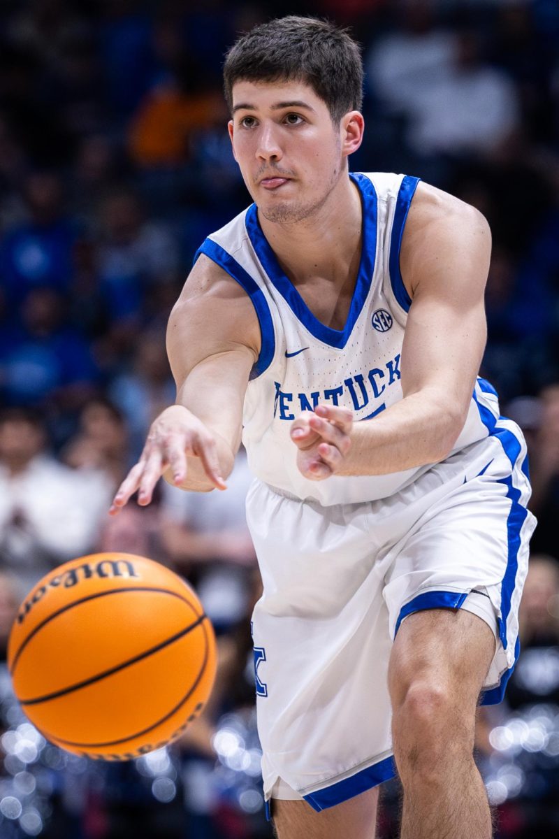 Kentucky guard Reed Sheppard (15) passes the ball during the No. 2 Kentucky vs. No. 7 Texas A&M mens basketball match in the SEC Tournament quarterfinals on Friday, March 15, 2024, at Bridgestone Arena in Nashville, Tennessee. Kentucky lost 97-87. Photo by Samuel Colmar | Staff