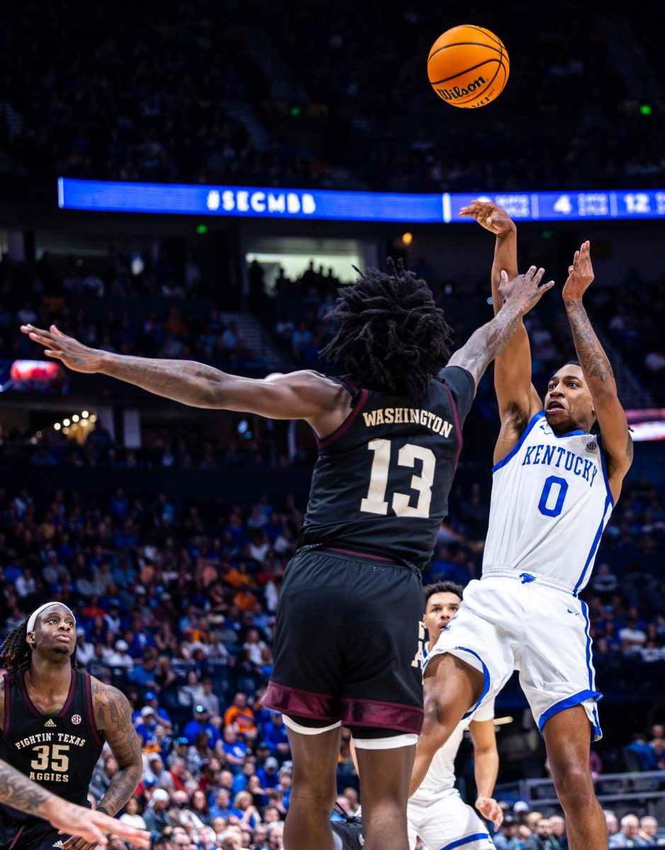Kentucky guard Rob Dillingham (0) shoots the ball during the No. 2 Kentucky vs. No. 7 Texas A&M mens basketball match in the SEC Tournament quarterfinals on Friday, March 15, 2024, at Bridgestone Arena in Nashville, Tennessee. Kentucky lost 97-87. Photo by Samuel Colmar | Staff