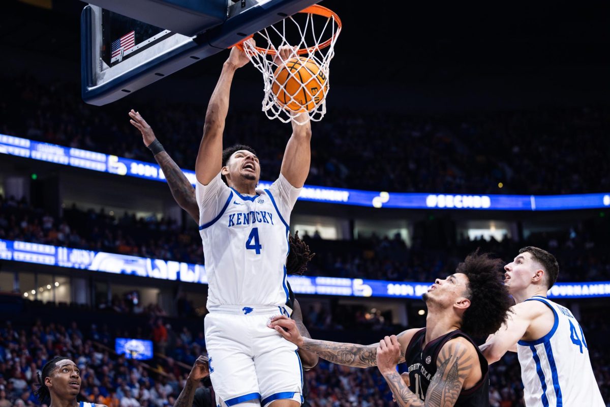 Kentucky forward Tre Mitchell (4) dunks the ball during the No. 2 Kentucky vs. No. 7 Texas A&M mens basketball match in the SEC Tournament quarterfinals on Friday, March 15, 2024, at Bridgestone Arena in Nashville, Tennessee. Kentucky lost 97-87. Photo by Samuel Colmar | Staff