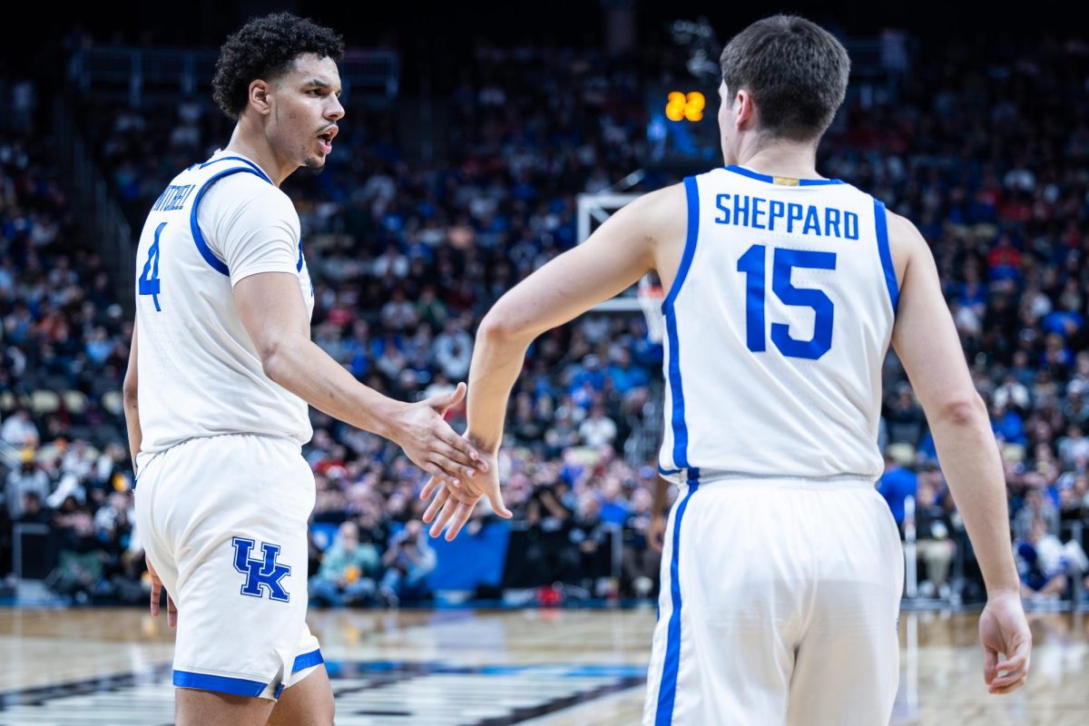 Kentucky forward Tre Mitchell (4), left, high-fives guard Reed Sheppard (15) during the No. 3 Kentucky vs. No. 14 Oakland mens basketball game in the first round of the NCAA Tournament on Thursday, March 21, 2024, at the PPG Paints Arena in Pittsburgh, Pennsylvania. Kentucky lost 80-76. Photo by Samuel Colmar | Staff