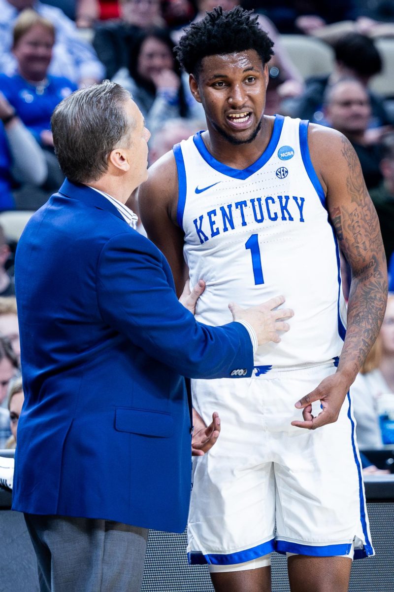 Kentucky head coach John Calipari, left, speaks with guard Justin Edwards (1) during the No. 3 Kentucky vs. No. 14 Oakland mens basketball game in the first round of the NCAA Tournament on Thursday, March 21, 2024, at the PPG Paints Arena in Pittsburgh, Pennsylvania. Kentucky lost 80-76. Photo by Samuel Colmar | Staff