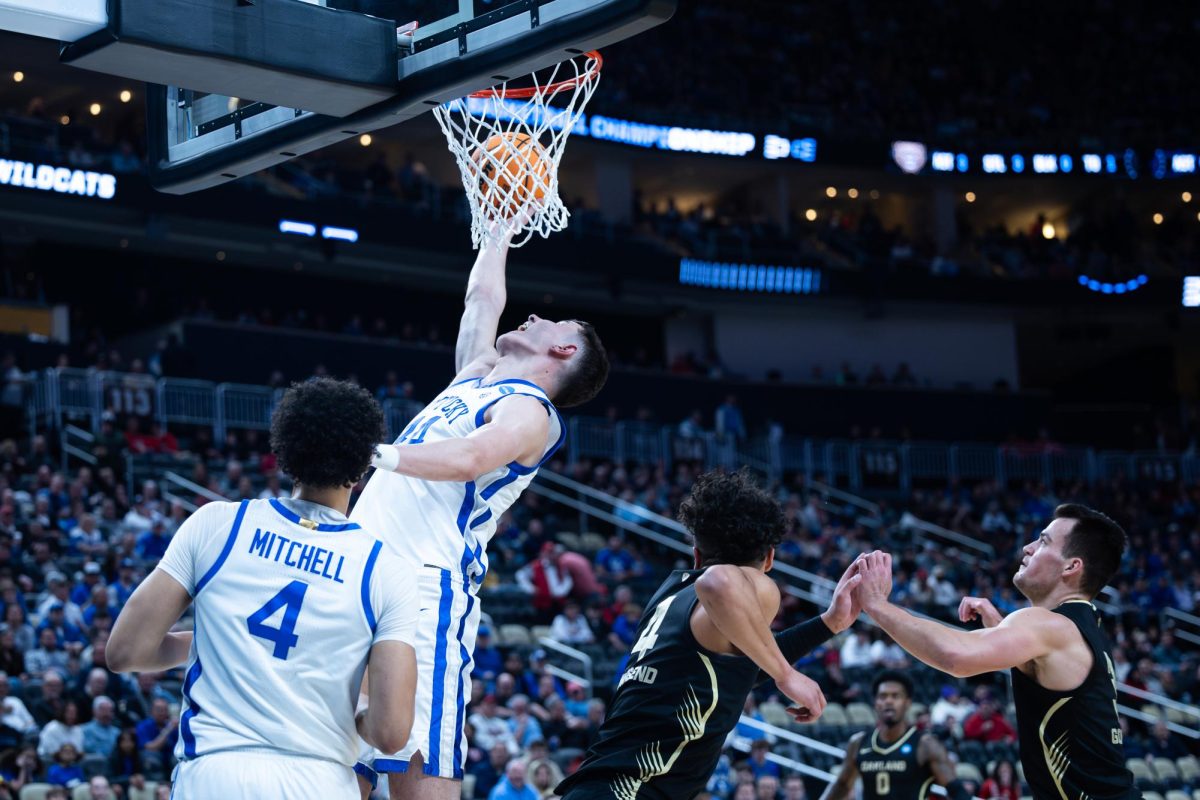 Kentucky forward Zvonimir Ivišić (44) goes for a dunk during the No. 3 Kentucky vs. No. 14 Oakland mens basketball game in the first round of the NCAA Tournament on Thursday, March 21, 2024, at the PPG Paints Arena in Pittsburgh, Pennsylvania. Photo by Samuel Colmar | Staff