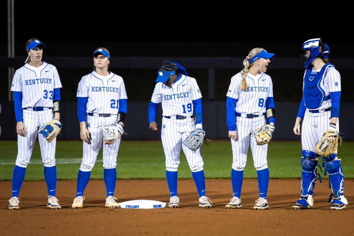 Kentucky players stand at second base during the No. 21 Kentucky vs. No. 3 LSU softball match on Friday, March 8, 2024, at John Cropp Stadium in Lexington, Kentucky. Kentucky lost 6-2. Photo by Samuel Colmar | Staff