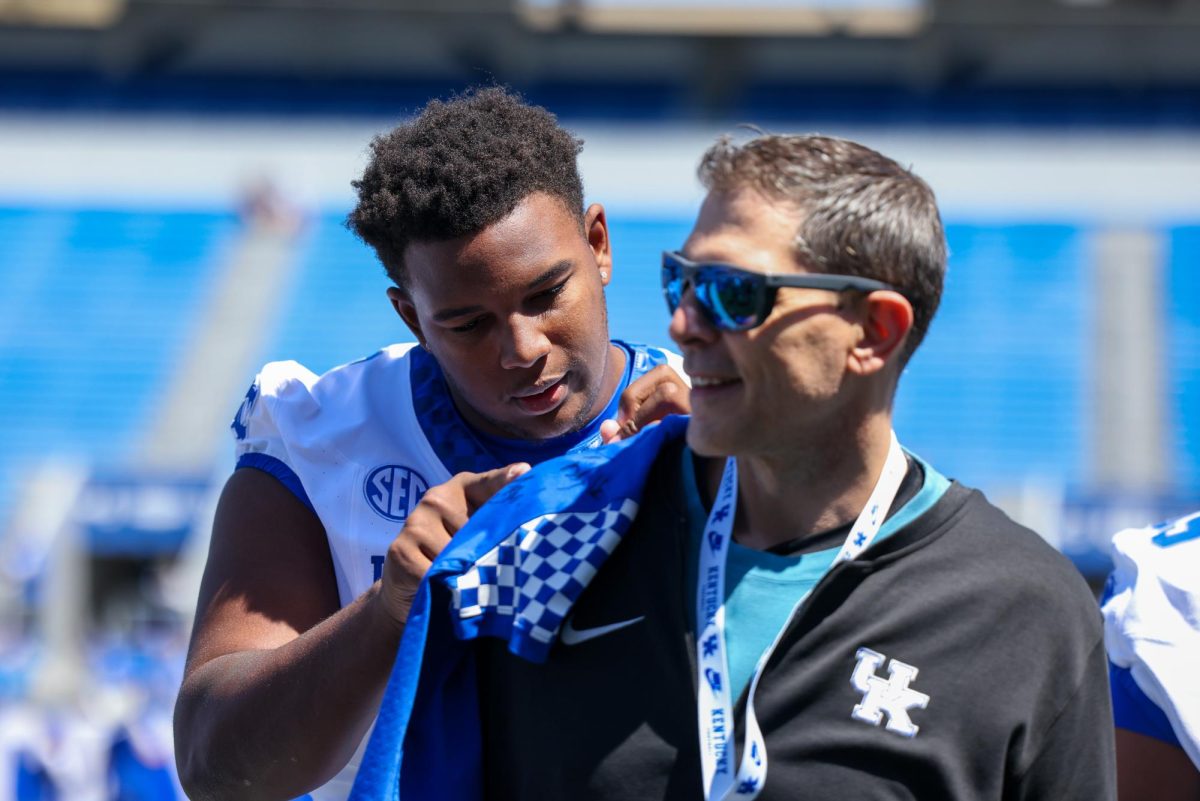 Kentucky defensive lineman Deone Walker (0) signs a jersey before the Kentucky Blue-White Spring football game on Saturday, April 13, 2024, at Kroger Field in Lexington, Kentucky. Photo by Sydney Yonker | Staff