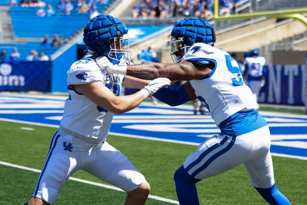 Kentucky inside linebacker Hayden Dawahare and outside lineman Noah Matthews warm up during the Kentucky Blue-White Spring football game on Saturday, April 13, 2024, at Kroger Field in Lexington, Kentucky. Photo by Sydney Yonker | Staff