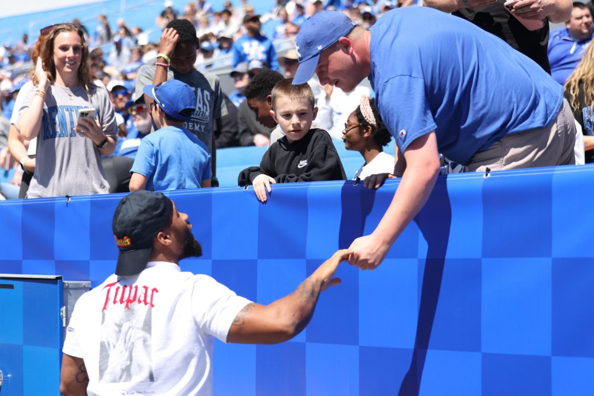 Former Kentucky football player Ray Davis talks to fans during the Kentucky Blue-White Spring football game on Saturday, April 13, 2024, at Kroger Field in Lexington, Kentucky. Photo by Sydney Yonker | Staff