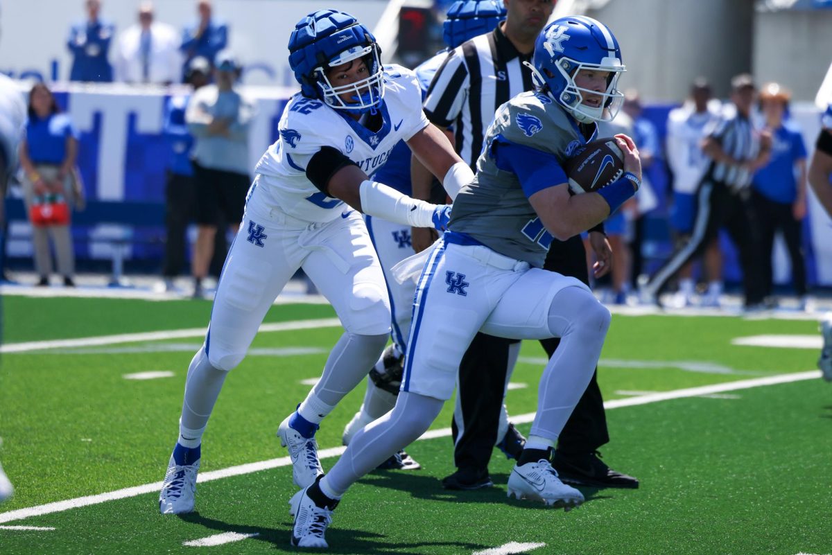 Kentucky quarterback Brock Vandagriff gets tackled by Kentucky outside linebacker Grant Godfrey during the Kentucky Blue-White Spring football game on Saturday, April 13, 2024, at Kroger Field in Lexington, Kentucky. Photo by Sydney Yonker | Staff