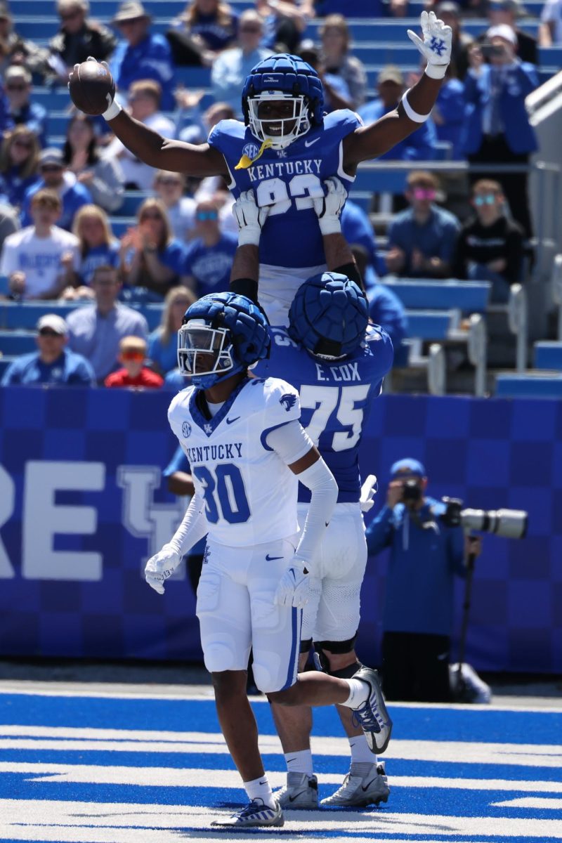 Kentucky tight end Kamari Anderson and offensive lineman Eli Cox celebrate a touch down during the Kentucky Blue-White Spring football game on Saturday, April 13, 2024, at Kroger Field in Lexington, Kentucky. Photo by Sydney Yonker | Staff
