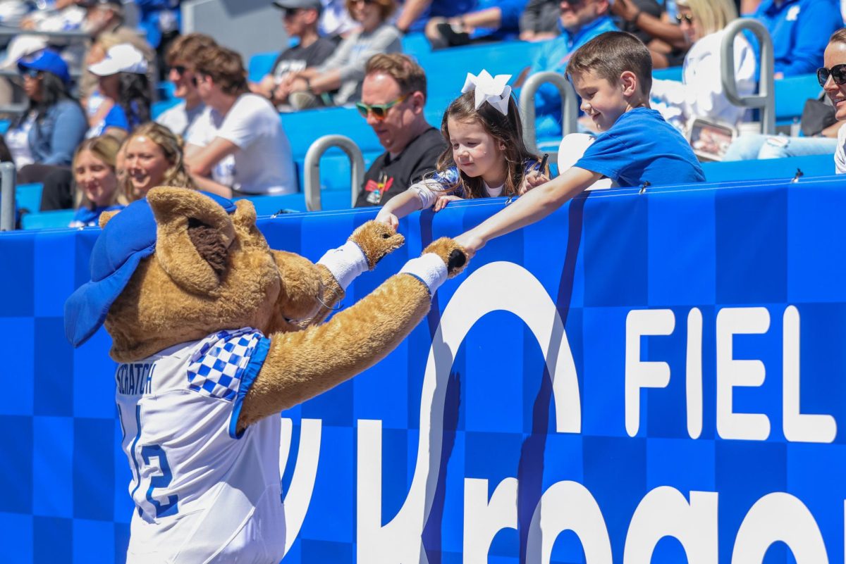 Kentucky mascot Scratch fist bumps young fans during the Kentucky Blue-White Spring football game on Saturday, April 13, 2024, at Kroger Field in Lexington, Kentucky. Photo by Sydney Yonker | Staff