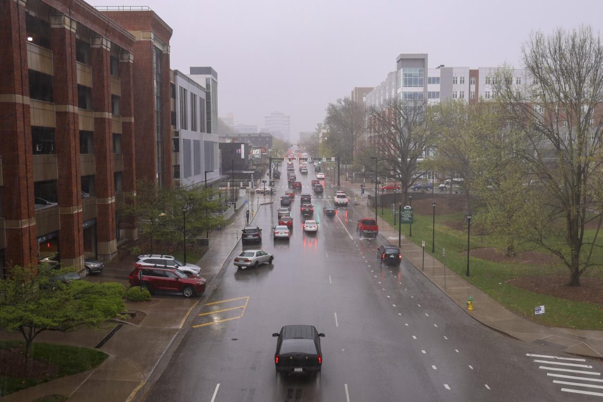 Cars navigate through heavy rain down South Limestone as the second round of storms start on Tuesday, April 2, 2024, at the University of Kentucky in Lexington, Kentucky. Photo by Matthew Mueller | Staff