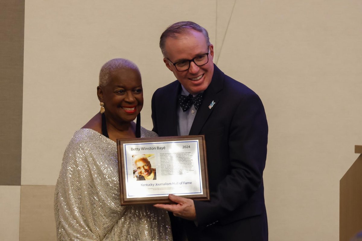 Betty Winston Bayé and Duane Bonifer pose for a photo after Bayé is inducted into the Kentucky Journalism Hall of Fame on Tuesday, April 9, 2024, at University of Kentucky in Lexington, Kentucky. Photo by Matthew Mueller | Staff