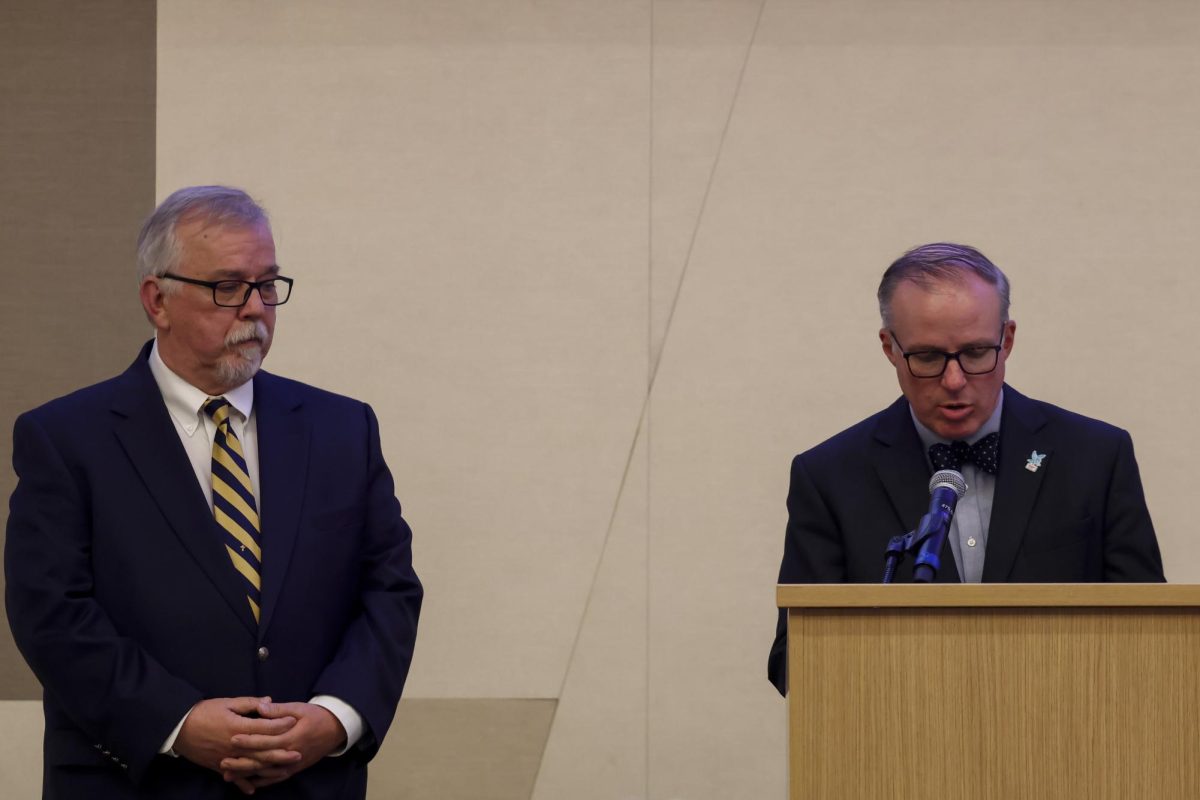 Duane Bonifer introduces Paul Prather to the stage to be inducted into the Kentucky Journalism Hall of fame on Tuesday, April 9, 2024, at University of Kentucky in Lexington, Kentucky. Photo by Matthew Mueller | Staff