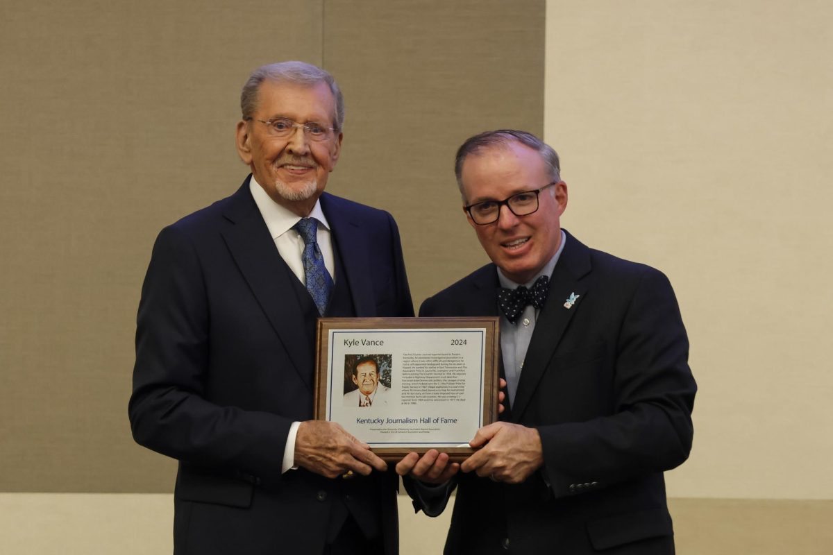 David Vance accepts his father the late Kyle Vance’s induction into the Kentucky Journalism Hall of Fame on Tuesday, April 9, 2024, at University of Kentucky in Lexington, Kentucky. Photo by Matthew Mueller | Staff