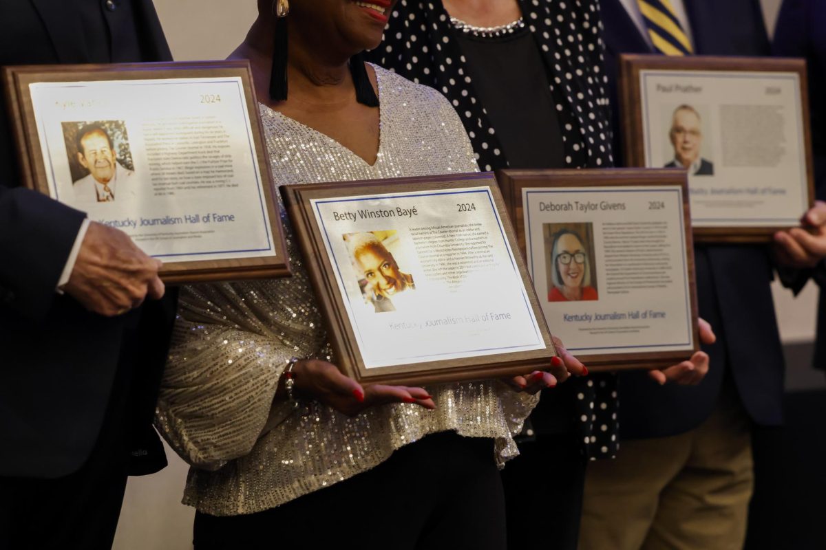 Inductees hold their plaques while posing for a photo during the Kentucky Journalism Hall of Fame Induction on Tuesday, April 9, 2024, at University of Kentucky in Lexington, Kentucky. Photo by Matthew Mueller | Staff