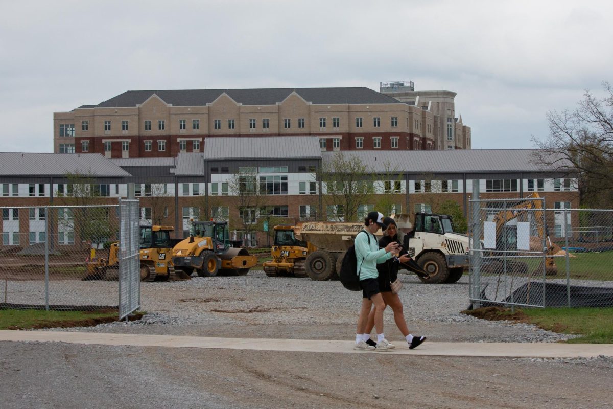 Students walks past construction taking place the South Lawn on Wednesday, April 10, 2024, at University of Kentucky in Lexington, Kentucky. Photo by Christian Kantosky | Staff