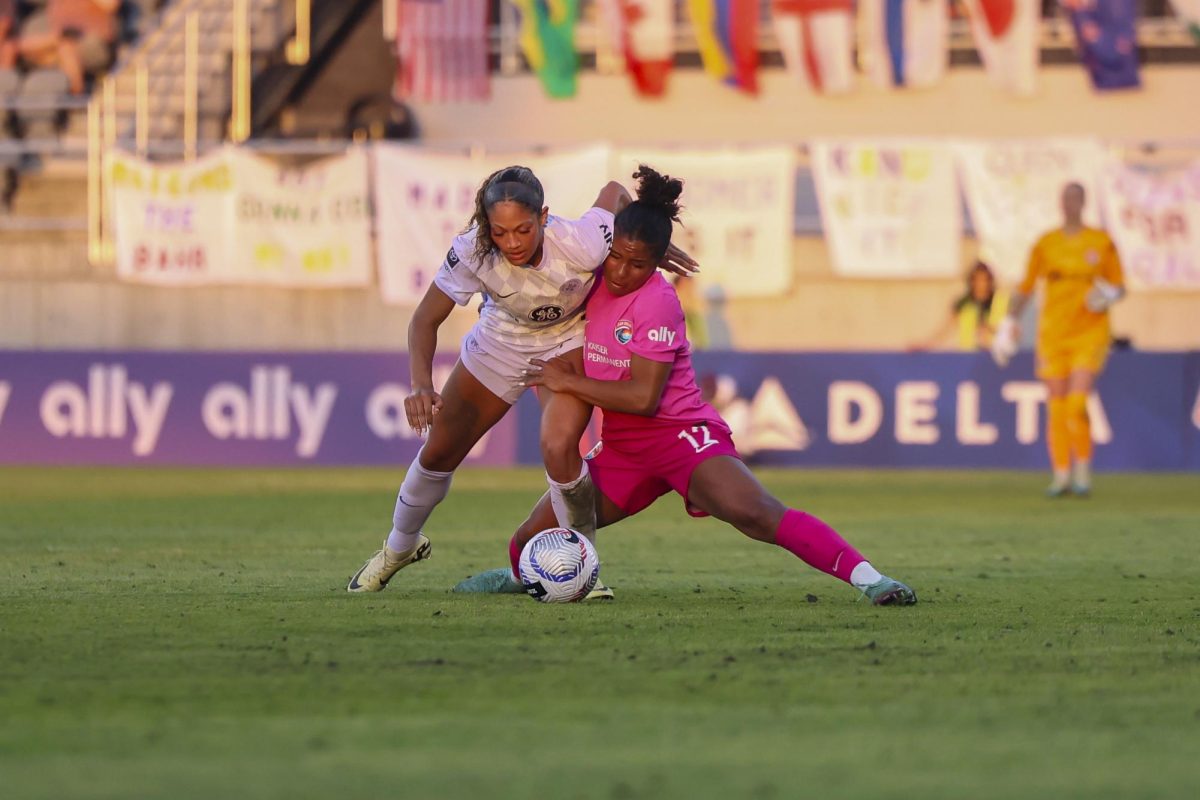 Kennedy Wesley fights for possession on Saturday, April 13, 2024, at Lynn Family Stadium in Louisville, Kentucky. Racing FC tied 0-0 with San Diego Wave.  Photo by Matthew Mueller | Staff