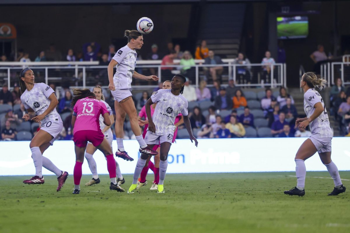 Arin Wright heads the ball out of Racings side of the pitch on Saturday, April 13, 2024, at Lynn Family Stadium in Louisville, Kentucky. Racing FC tied 0-0 with San Diego Wave.  Photo by Matthew Mueller | Staff