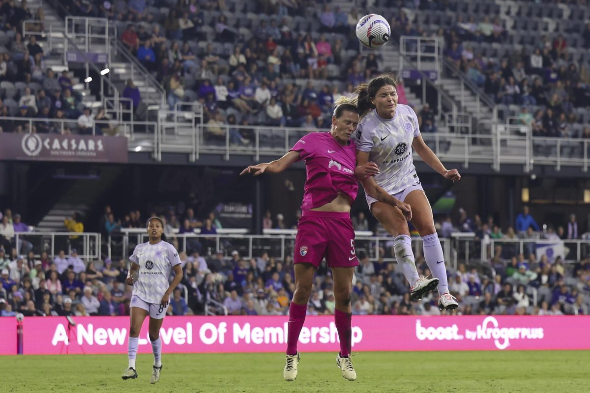 Emma Sears heads the ball on Saturday, April 13, 2024, at Lynn Family Stadium in Louisville, Kentucky. Racing FC tied 0-0 with San Diego Wave.  Photo by Matthew Mueller | Staff