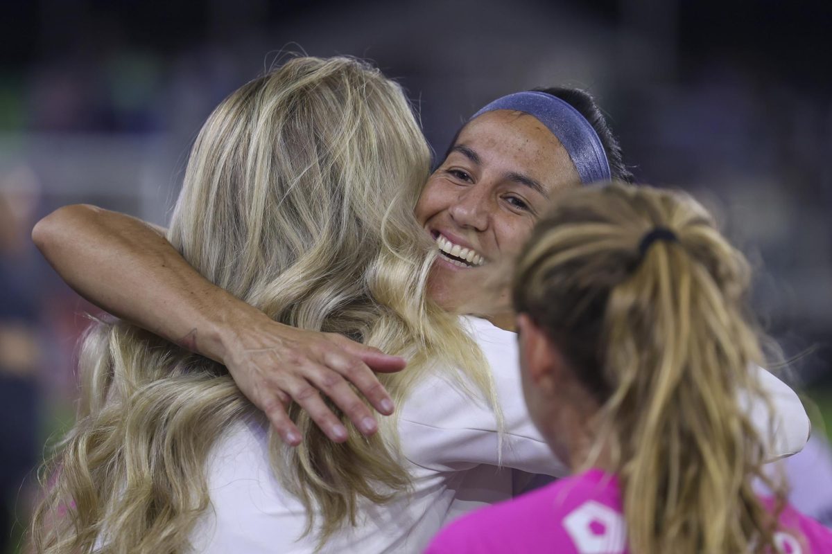 Abby Erceg hugs a staff member on Saturday, April 13, 2024, at Lynn Family Stadium in Louisville, Kentucky. Racing FC tied 0-0 with San Diego Wave.  Photo by Matthew Mueller | Staff