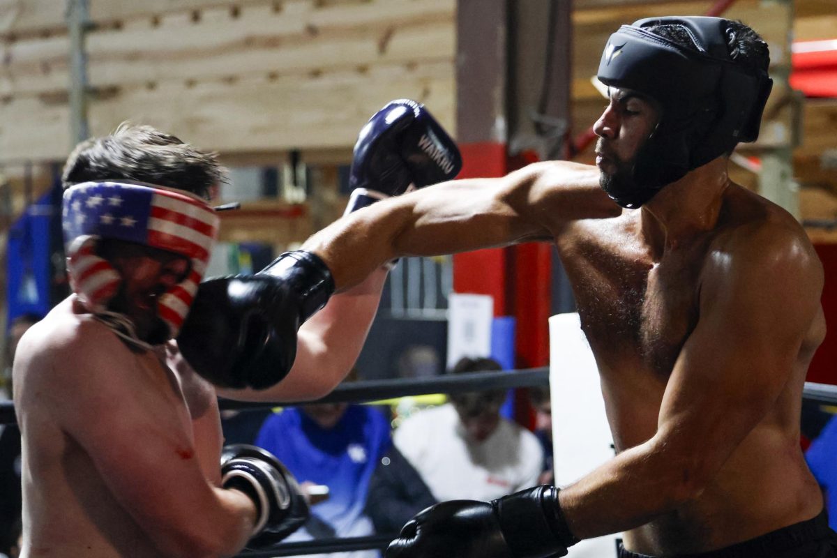 Ahmed Elhusseini lands a punch on Aiden Greenwell during the UK Boxing club exhibition match on Friday, April 12, 2024, at Thrive Tribe Boxing club in Lexington, Kentucky. Photo by Matthew Mueller | Staff