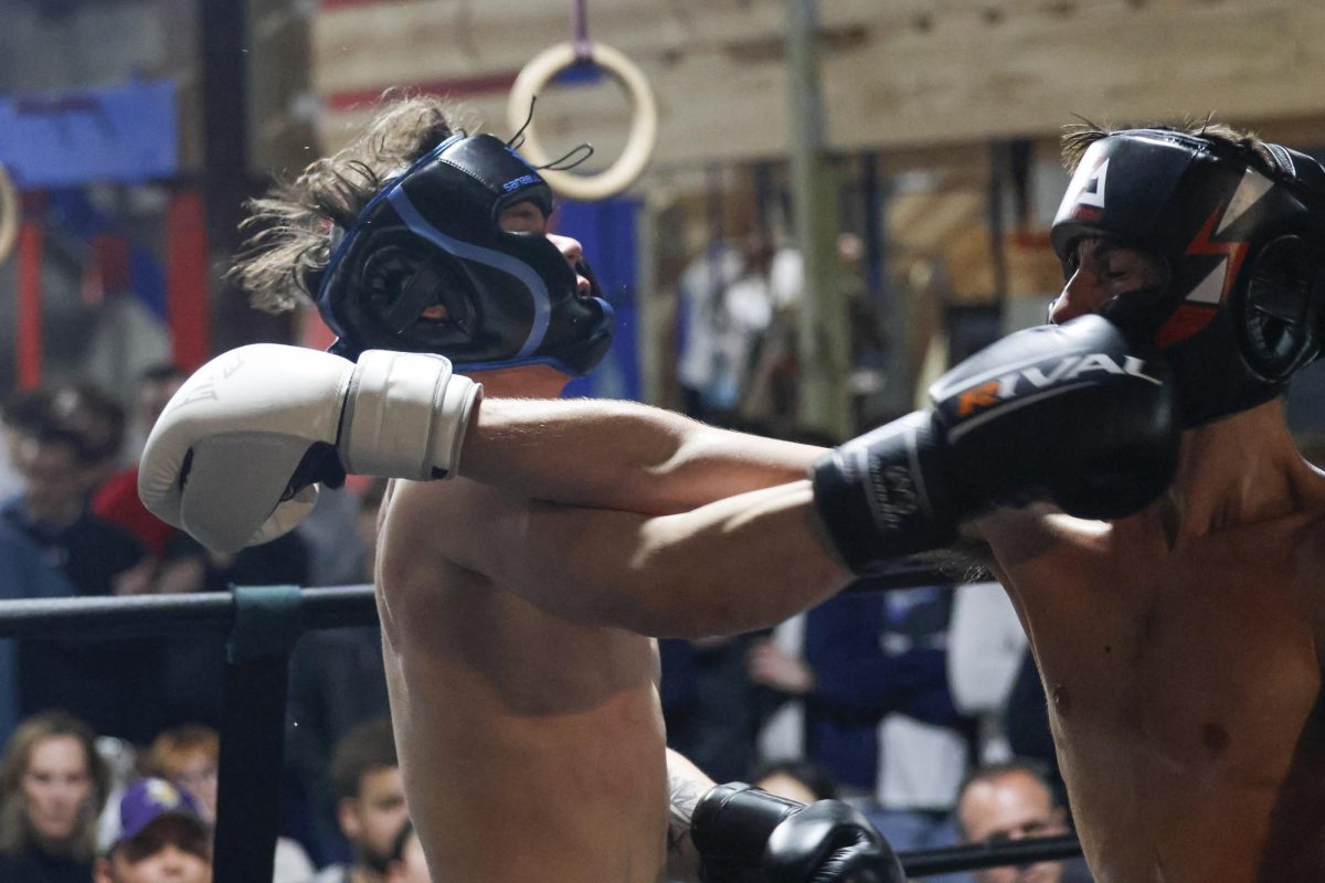Anton Ffiske and Trent Breuer exchange punches during the UK Boxing club exhibition match on Friday, April 12, 2024, at Thrive Tribe Boxing club in Lexington, Kentucky. Photo by Matthew Mueller | Staff