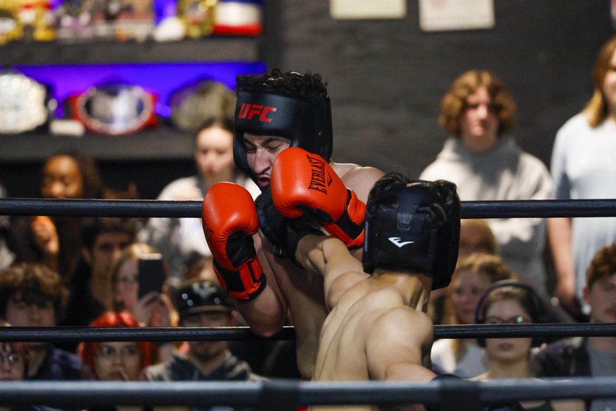 Ricky Chen lands a punch against Juan Quijand during the UK Boxing club exhibition match on Friday, April 12, 2024, at Thrive Tribe Boxing club in Lexington, Kentucky. Photo by Matthew Mueller | Staff