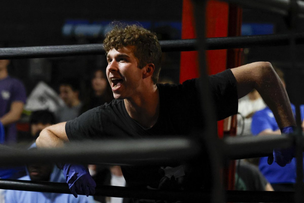 Coach of the UK boxing club shouts out calls during the UK Boxing club exhibition match on Friday, April 12, 2024, at Thrive Tribe Boxing club in Lexington, Kentucky. Photo by Matthew Mueller | Staff
