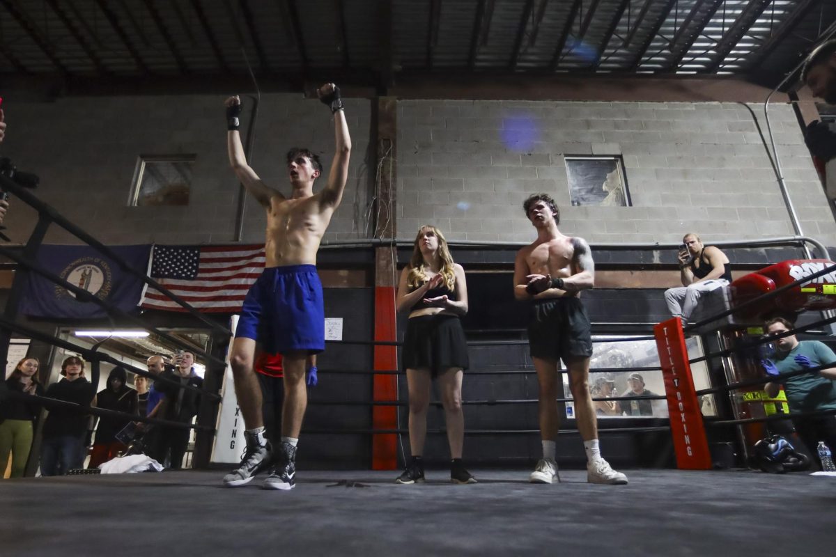 Anton Ffiske raises his arms after winning his match vs Trent Breuer during the UK Boxing club exhibition match on Friday, April 12, 2024, at Thrive Tribe Boxing club in Lexington, Kentucky. Photo by Matthew Mueller | Staff