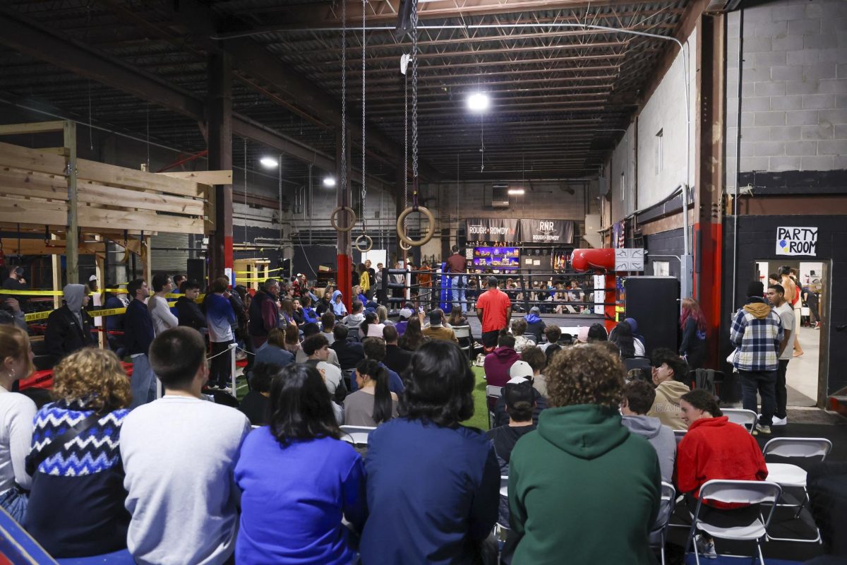 Fans gather for the start of the match during the UK Boxing club exhibition match on Friday, April 12, 2024, at Thrive Tribe Boxing club in Lexington, Kentucky. Photo by Matthew Mueller | Staff